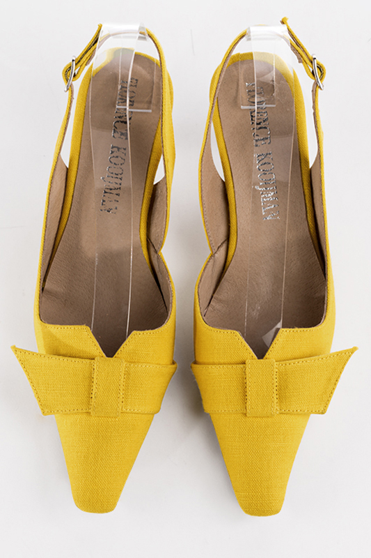 Yellow women's open back shoes, with a knot. Tapered toe. Medium spool heels. Top view - Florence KOOIJMAN